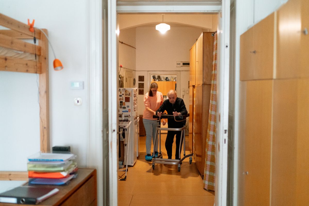 Senior with walking support at home